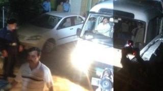 Minibus carries Osama Bin Laden's wives and children from their Islamabad villa to the airport on Thursday