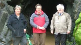 Cornwall councillors - Richard Pugh, Bernie Ellis and Brian Gisbourne - outside the cave