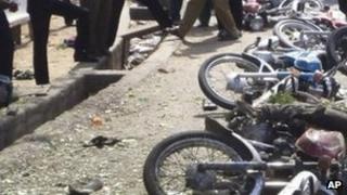 A row of toppled bikes after a bomb hit Jalingo, Nigeria, Monday, April 30, 2012