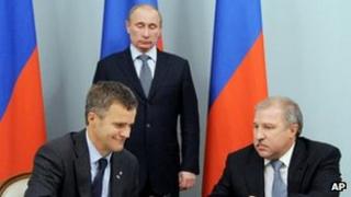 Russian Prime Minister and President-elect Vladimir Putin, Norway"s Statoil Chief Executive Helge Lund, left, and Rosneft president Eduard Khudainatov