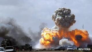 Explosions follow a Nato air strike on forces loyal to Muammar Gaddafi between Benghazi and Ajdabiyah, 20 March 2011