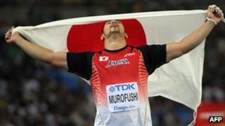 Japan's Koji Murofushi celebrates victory