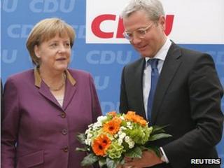 Chancellor Angela Merkel and Environment Minister Norbert Roettgen after election defeat in North Rhine-Westphalia