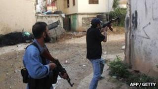 Two gunmen on the streets of Tripoli. Photo: 14 May 2012
