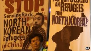 A South Korean Christian participates in a service to demand Chinese government to release North Korean refugees captured in China, near the Chinese Embassy in Seoul, South Korea, Monday, April 23, 2012.