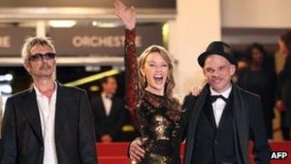 Kylie Minogue flanked by Holy Motors director Leos Carax (left) and actor Denis Lavant