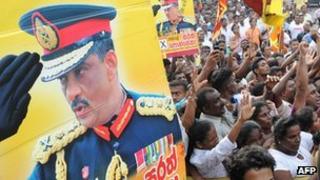 Supporters of Sri Lanka's former army chief Sarath Fonseka celebrate as he leaves the main prison in Colombo on May 21, 2012.