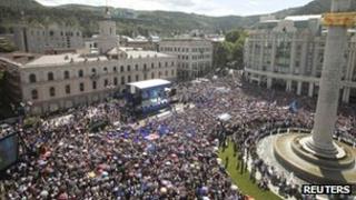 Supporters of opposition parties take part in a mass anti-government protest gathering in the streets of the capital Tbilisi