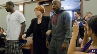 Floyd Mayweather Jr (right) walks into court escorted by his attorney Karen Winckler, center, and 50 Cent, left, to begin his 90-day jail term, June 1