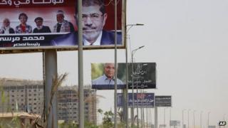 Posters for Mohammad Mursi (foreground) and Ahmed Shafik, Cairo