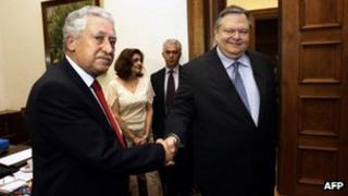 Pasok leader Evangelos Venizelos (right) shakes hands with his Democratic Left counterpart, Fotis Kouvelis