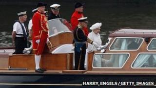 The Queen's launch makes its way down the river