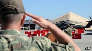 Turkish soldiers observe a minute of silence on June 20, 2012 for colleagues who were killed on June 19 in an attack allegedly carried out by members of the Kurdistan Workers' Party (PKK)