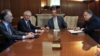 Greece's Prime Minister Antonis Samaras (C), Leader of the Democratic Left party Fotis Kouvelis (2nd L), Foreign Minister Vassilis Rapanos (L) and leader of Pasok Evangelos Venizelos (R) meet at the prime minister's office on June 21, 2012