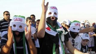 People demonstrating against Syria's President Bashar al-Assad outside the Syrian embassy in Amman June 21, 2012