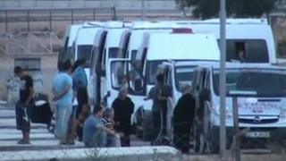 Refugees in Hatay province after their arrival from Syria on 25 June