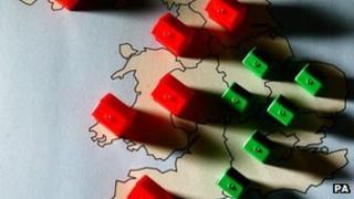 Monopoly pieces on map