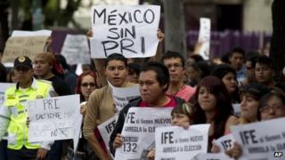 Demonstrators protest outside an office of the Federal Electoral Institute in Mexico City July 3, 2012