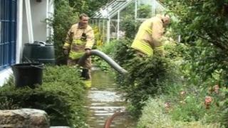 Fire crews pumping water out of homes