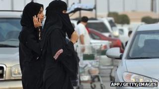 Saudi women walk outside a shopping mall (File)