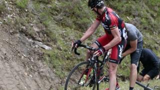 Rider has a puncture repaired