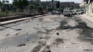 Tank tracks are seen on a street at al-Midan neighbourhood in Damascus July 20, 2012.