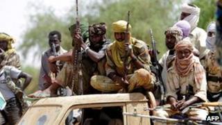 Rebel fighters in Darfur. File photo