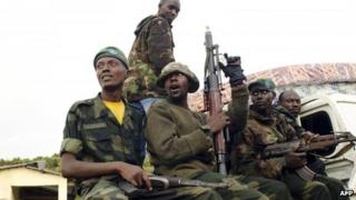 M23 rebels sit at the back of a pick-up truck - 15 July 2012