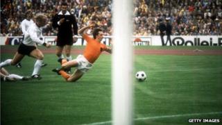 Referee Jack Taylor watches as Johan Cruyff brought down in first minute of the 1974 World Cup final