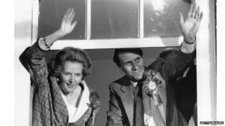 Margaret Thatcher and Norman Tebbit waving from inside Smith Square after the 1987 election