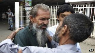 Bangladeshi Moslemuddin Sarkar being welcomed back by relatives at Dhaka airport on 31 July 2012 after going missing for 23 years