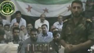 Syrian rebels show off a group said to be Iranian hostages (video grab from YouTube)