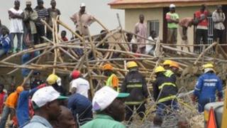 Rescue workers at the collapsed building