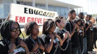 Black activists outside the presidential palace in Brasilia