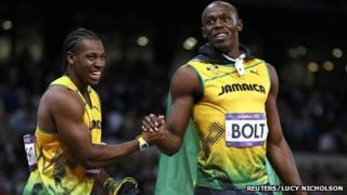 Jamaica"s Usain Bolt (R) shakes hands with team mate and second-placed Yohan Blake after winning the men's 100m final during the London 2012 Olympic Games