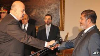 Egyptian Vice-President Mahmud Mekki (L) at his swearing-in ceremony with President Mohammed Morsi
