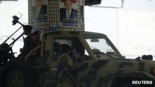 Army soldiers are positioned on a street near the Defence Ministry"s compound in Sanaa