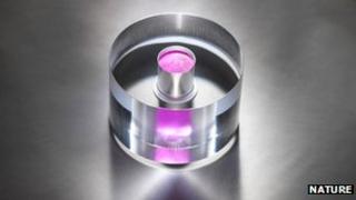 Pentacene-doped p-terphenyl crystal surrounded by a clear sapphire ring