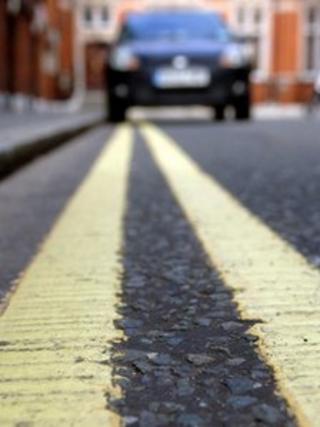 Car parked on double yellow line