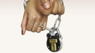 Couple's hands in chains