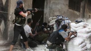 Rebels fighting in the Salaheddin neighbourhood of Syria's northern city of Aleppo, 22 August