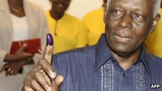 Angolan President Jose Eduardo dos Santos shows his ink-stained finger to prove he cast his ballot. Photo: 31 August 2012