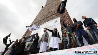 Tunisian Salafists shout slogans claiming an Islamic state as they stage a demonstration on March 25, 2012 in Tunis