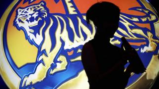 Model with bottle of Tiger beer