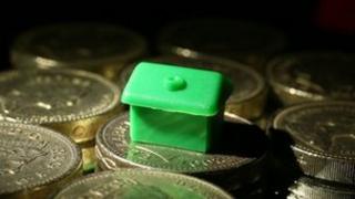 Monopoly piece on coins