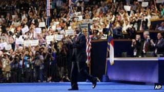 President Barack Obama walks out on stage to greet former President Bill Clinton at the Democratic National Convention