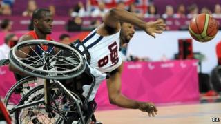 USA's Trevon Jenifer falls from his wheelchair during the men's wheelchair basketball bronze medal match