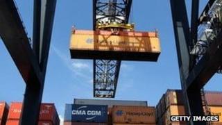 Cargo containers being moved at a port