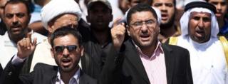 Iraqis chant slogans during a protest in Basra