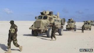 Peacekeepers from the African Union Mission in Somalia patrol after capturing the Elmaan seaport from al Shabab insurgents September 4, 2012